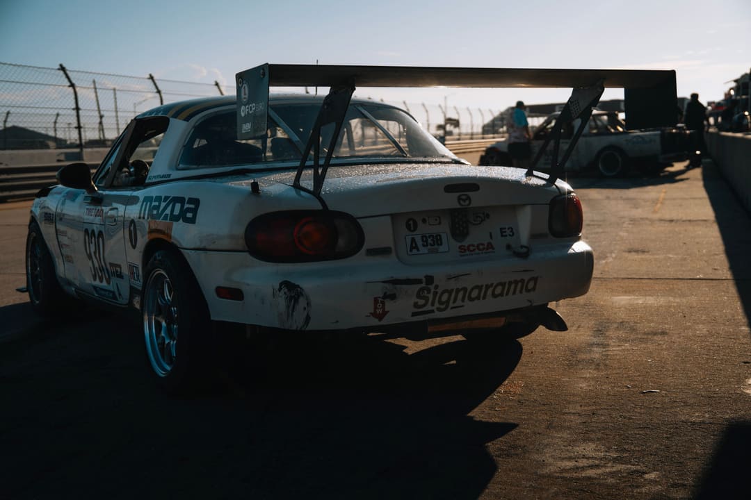 The #930 from behind in the paddock at dusk.