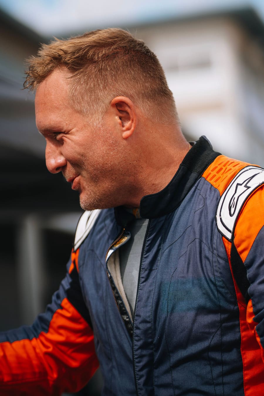 The team principal in his suit between sessions.