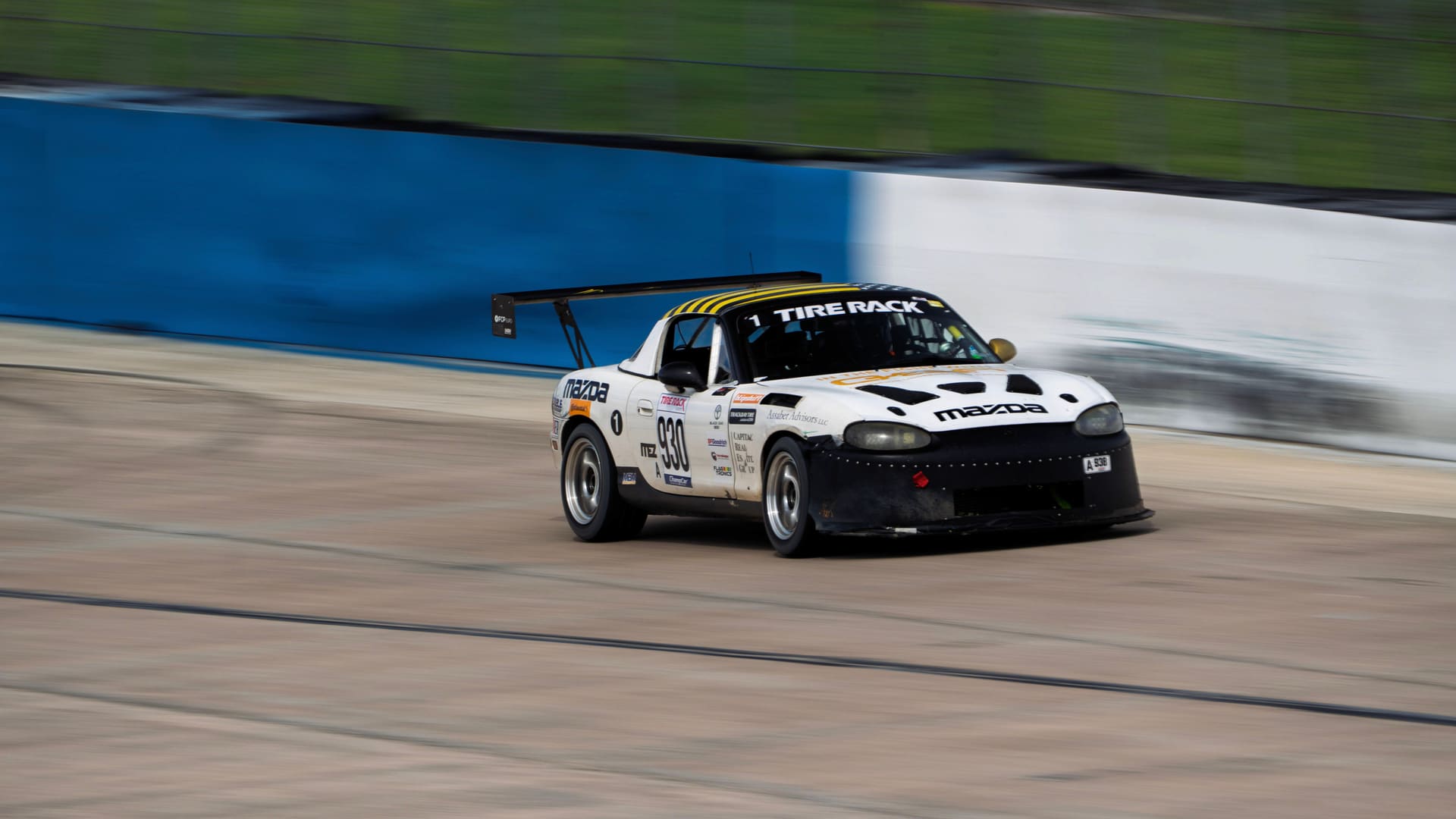 Panning shot of the #930 through a Sebring corner.