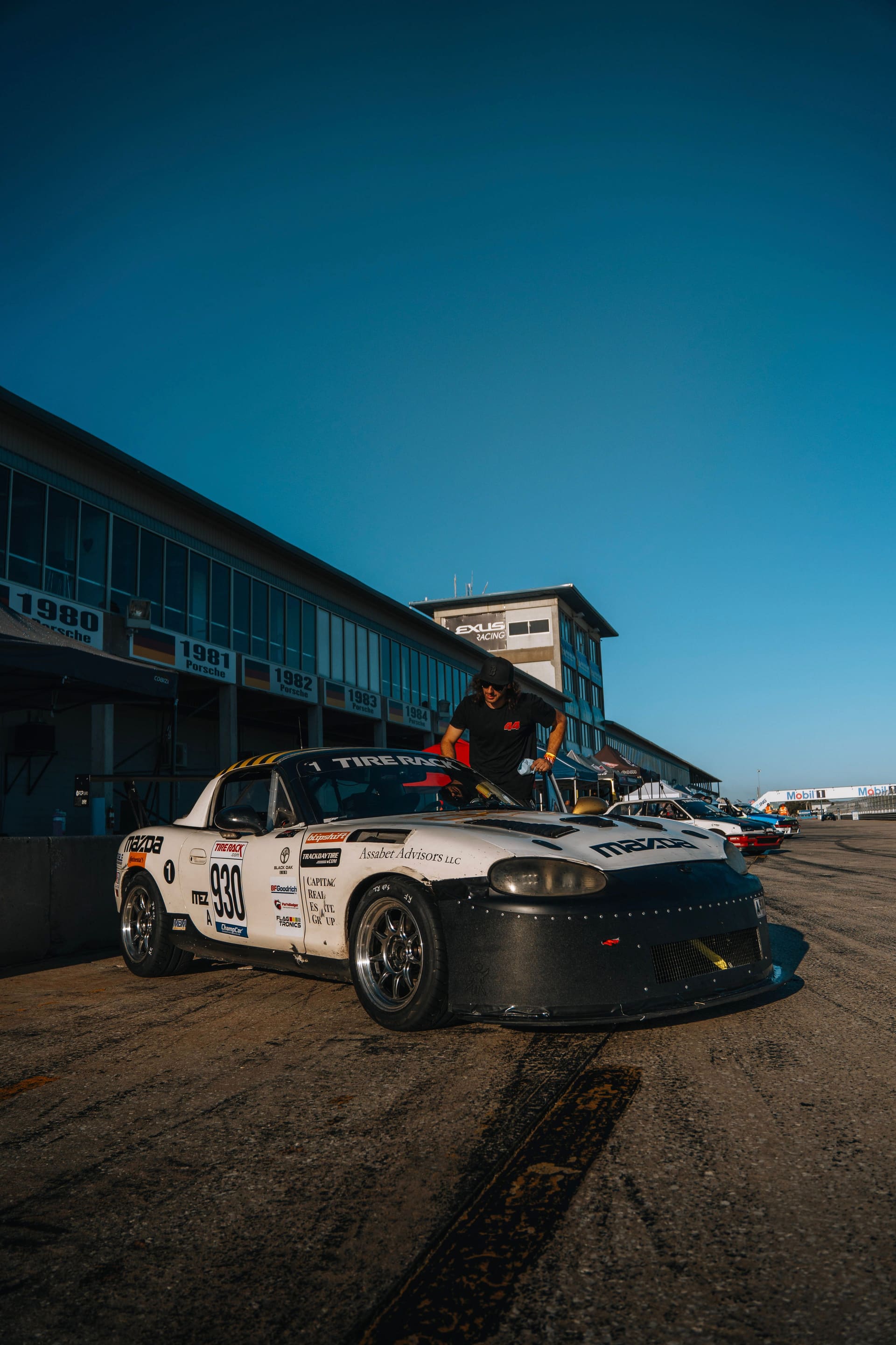 The car waiting in the Sebring pit lane under a hard blue sky.
