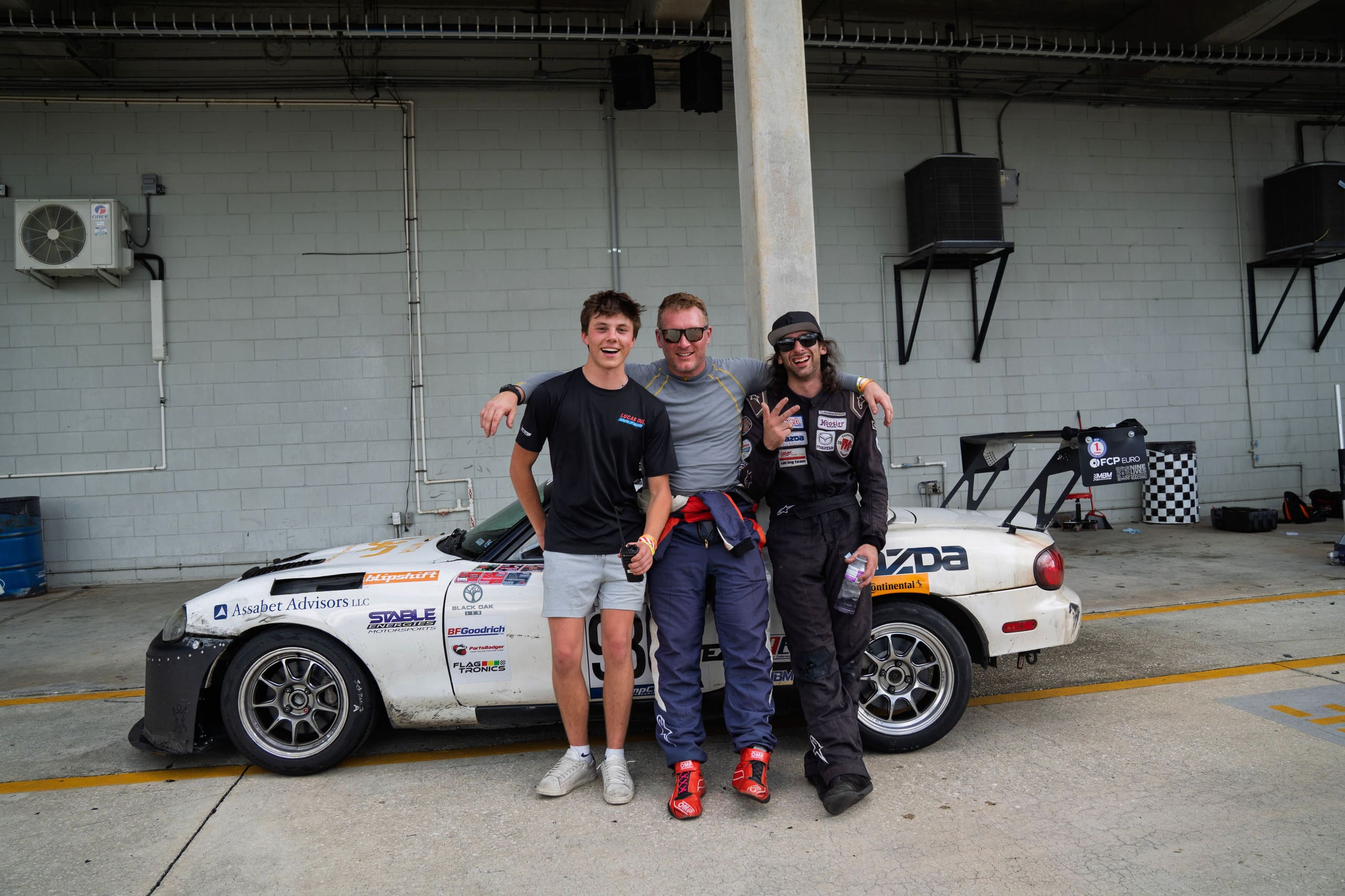 The team beside the #930 in the Sebring garage at the end of the weekend.